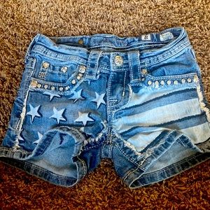 Girls Miss Me patriotic jean shorts.